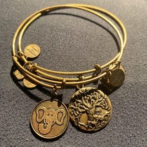 A pair of Alex and Ani bracelets; elephant and tree of life